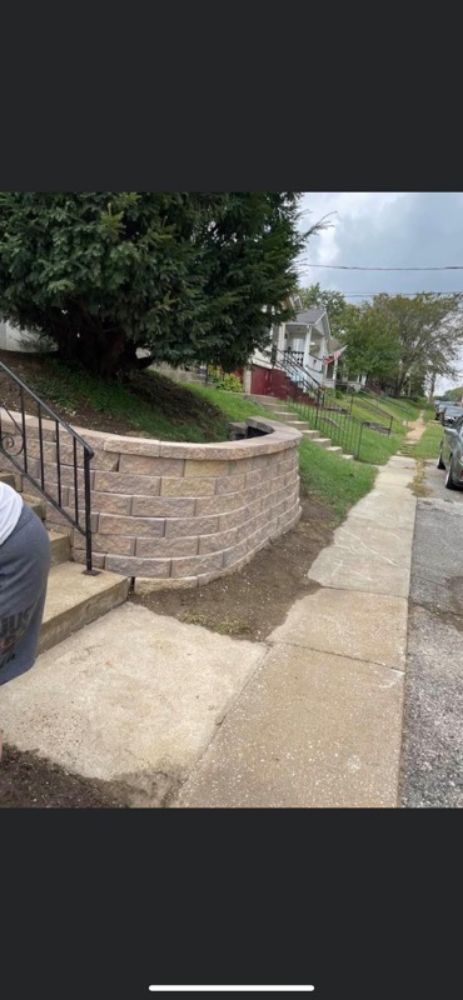 Completed curved block retaining wall in a Hazelwood front yard