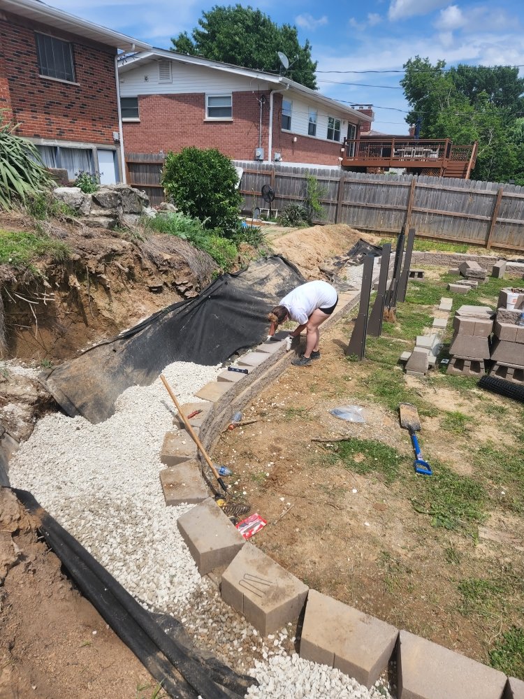 Amanda's Greenthumb crew building a retaining wall for a Missouri backyard