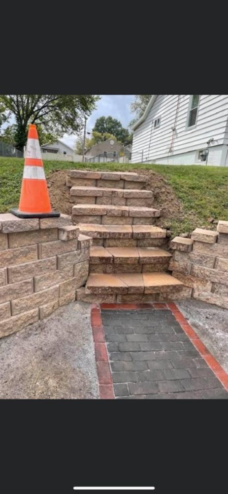Retaining wall with built-in paver steps and walkway